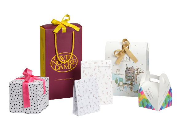 Auf der Grafik sehen Sie Papierbeutel mit einem Briefumschlag, eine Wein-Geschenkverpackung namens Sake Box, ein Soft Case aus Papier perfekt für Pralinen und die innovative Pop-Up Box mit einer Schleife.